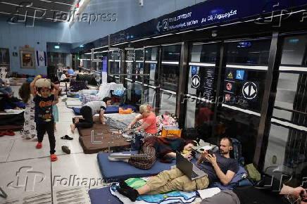 People shelter at Tel Aviv Light Rail Station amid ongoing Iranian ballistic missile threat
