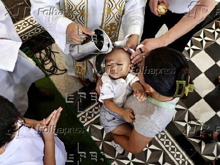 Mass baptism ceremony for children in Bacoor city