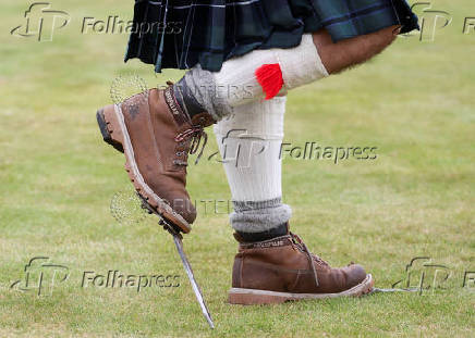 A competitor takes part in the Heavies event during the Braemar Royal Highland Gathering at the Princess Royal and Duke of Fife Memorial Park in Braemar, Scotland