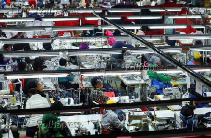 Workers perfom their duties at Quantum apparel factory on the outskirts of Maseru
