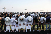 Israeli Muslims pray on the first day of the Muslim holiday of Eid al-Adha by the sea side of the Mediterranean, in Jaffa