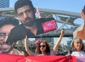 Supporters and families of hostages block a road in Tel Aviv