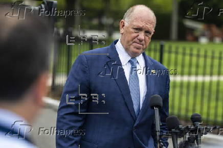 White House border czar Tom Homan talks with news media outside the White House