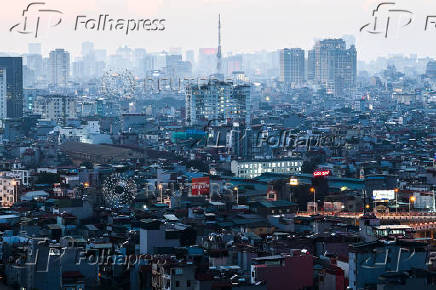 Lights illuminate buildings in Hanoi