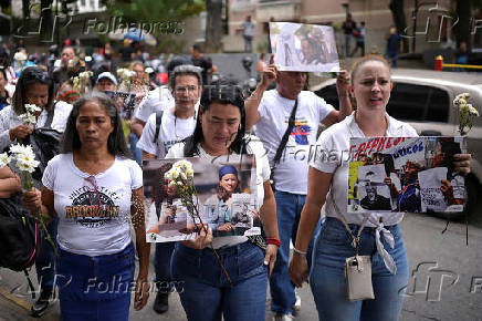 Relatives of detained Venezuelans, walk to the Miraflores presidential palace, in Caracas
