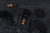 Bulldozers arrange coal at the SunCoke Jewell facility in Oakwood, Virginia
