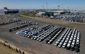 FILE PHOTO: Cars of the Volkswagen Group are waiting to be exported to the US from the seaport of Emden