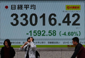 Electronic screen displaying Japan's Nikkei share average outside a brokerage in Tokyo