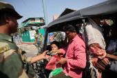 Border Security Force (BSF) checks the passports of Pakistani citizens as they prepare to leave India after India revoked all visas issued to Pakistani citizens at the Attari-Wagah border crossing near Amritsar
