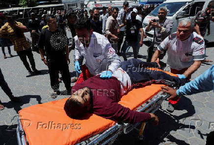Palestinian casualties are brought into Al-Aqsa Martyrs Hospital, following an Israeli strike, in Deir al-Balah