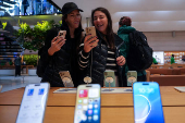 People visit Apple's Fifth Avenue store in New York City