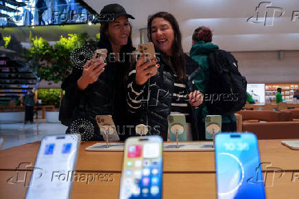 People visit Apple's Fifth Avenue store in New York City