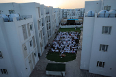Palestinians from Gaza attend Eid al-Adha prayers, at Al Thumama Complex,  in Doha