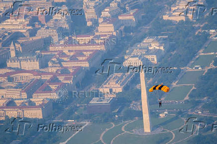 U.S. Army Golden Knights parachute team perform during the Twilight Tattoo ceremony