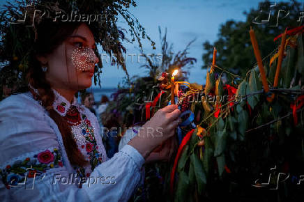 People take part in a celebration on the traditional Ivana Kupala in the village of Vytachiv, in Kyiv region