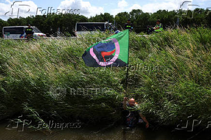 Extinction Rebellion activists block Dutch highway A44 ahead of the NATO summit at The Hague, near Abbenes