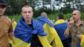 Ukrainian POWs are seen after a swap at an unknown location in Ukraine