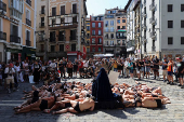 Protesters demonstrate for the permanent end of bullfighting and running of the bulls, a day before the start of the the San Fermin festival, in Pamplona