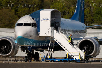 A Boeing jet intended for use by a Chinese airline returns to Boeing Field, in Seattle, Washington