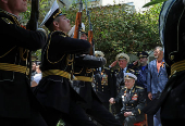 World War Two veteran Nikolai Golubtsov receives congratulations on the upcoming Victory Day in Sevastopol
