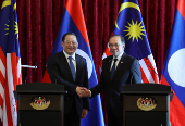 The Prime Minister of Laos meets his Malaysian counterpart during his visit to Malaysia