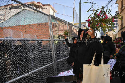 Evo Morales supporters march in mourning amid economic crisis, in La Paz