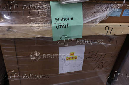 A view shows a container with components of the PanelClaw solar panel racking and mounting systems at McHone Industries Inc., in Clearfield,