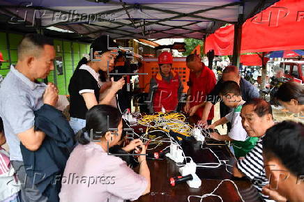 Disaster relief work underway in Longshan county as torrential rains weakened