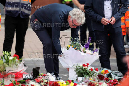 Fans pay their respects to soccer player Diogo Jota, at Anfield Stadium in Liverpool