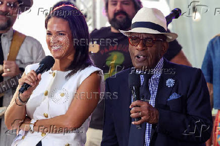'TODAY' show co-hosts Laura Jarrett and Al Roker smile during a taping of the show in New York