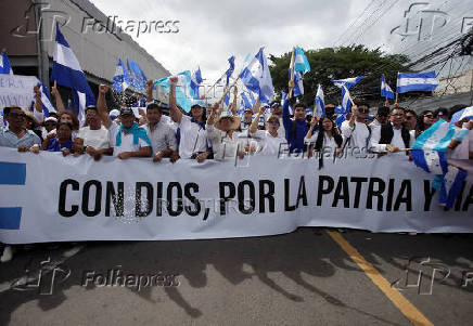 Supporters of the National Party of Honduras hold a march in Tegucigalpa