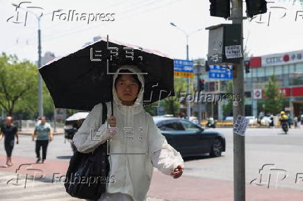 Beijing issues orange alert for heatwave