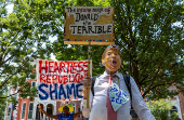 Activists rally during an anti-Trump protest march to the White House in Washington