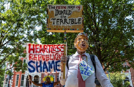 Activists rally during an anti-Trump protest march to the White House in Washington