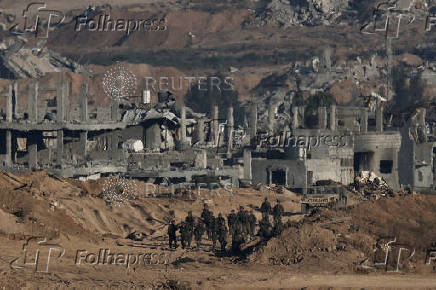 Israeli soldiers operate in Gaza, as seen from Israel