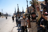 Fighters from Bedouin tribes deploy in the Druze-majority town of Mazra'a