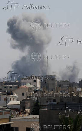 Smoke rises following an Israeli strike, in Khan Younis