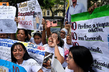 Family members of migrants imprisoned in El Salvador protest in Caracas