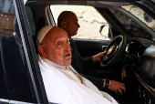Pope Francis looks on as he leaves Regina Coeli prison after a visit, in Rome