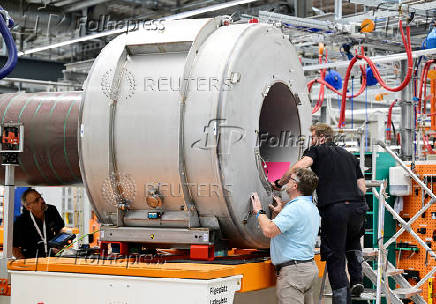 FILE PHOTO: Employees at Siemens Healthineers work on a MRI device in Erlangen