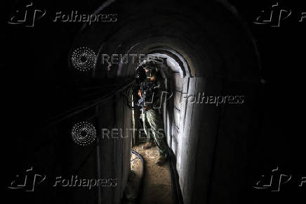 An Israeli soldier stands inside a tunnel underneath the European Hospital in Khan Younis at the Gaza Strip