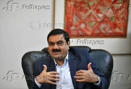 FILE PHOTO: Indian billionaire Gautam Adani speaks during an interview in Ahmedabad
