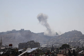 Smoke rises following Israeli airstrike next to the presidential palace in Damascus