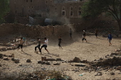 Yemeni youths play soccer in Sana'a
