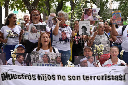Relatives of detained Venezuelans, walk to the Miraflores presidential palace, in Caracas