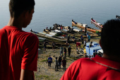 Fishermen unload their early morning catch on the shores of Lake Bayano, in Akua Yala