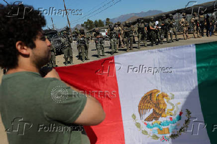 U.S. federal agents and immigration officers raid an agricultural facility in Camarillo