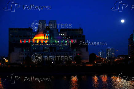The MI6 building is illuminated to mark the  Pride in London Parade in London
