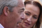 Britain?s Reform Party leader Farage and newly elected MP Pochin speak to journalists outside Houses of Parliament in London