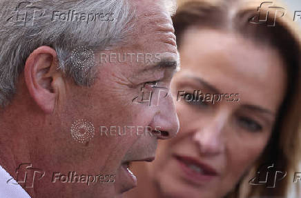Britain?s Reform Party leader Farage and newly elected MP Pochin speak to journalists outside Houses of Parliament in London